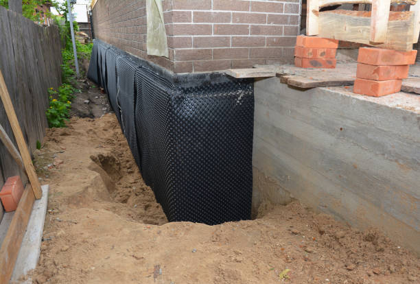 Happy homeowners after waterproofing job in Gambrills